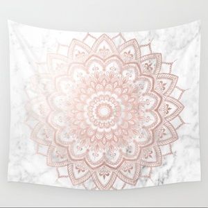 A big tapestry that is rose gold and marble